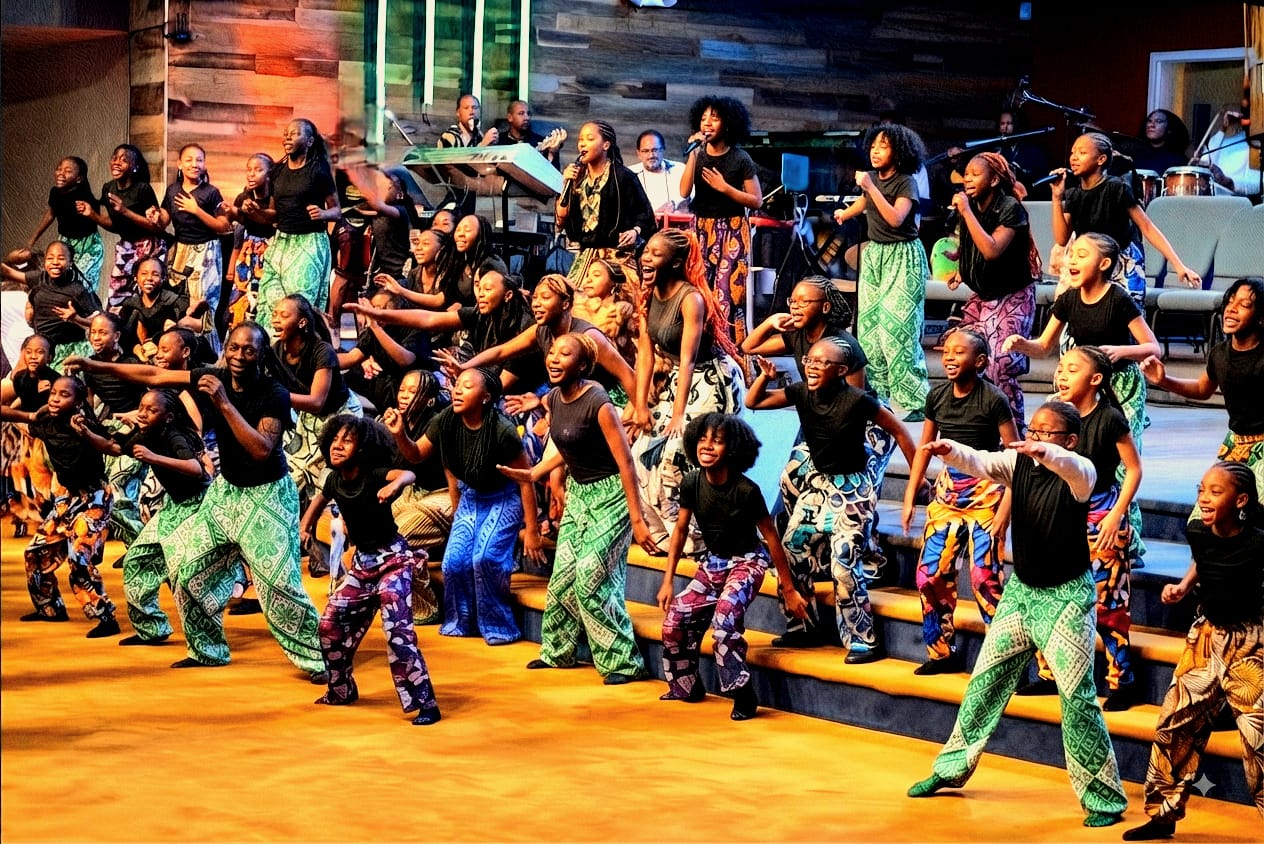 Young dancers performing together on a bright stage at a Terapo event